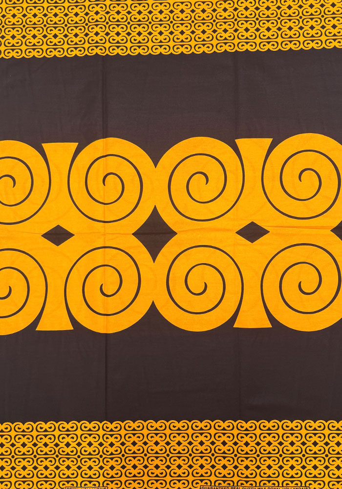 ankara wax print in black and orange-gold
