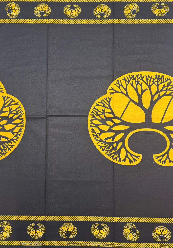 Black fabric with a bold yellow tree-of-life pattern and decorative borders,