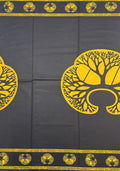 Black fabric with a bold yellow tree-of-life pattern and decorative borders,