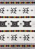 a patterned textile or wallpaper featuring horizontal bands of black tribal-style symbols, green and gold circular dots, and white spiral motifs on a light background.