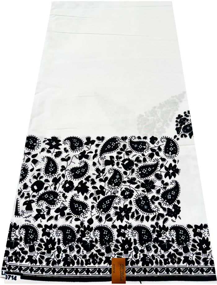 A piece of fabric with a Hollandais print featuring paisley pattern in black and white.