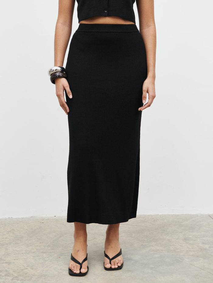 Celeste is 5'7.5" & Wears Size UK S|Reese Midaxi Knit Skirt - Black