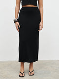 Celeste is 5'7.5" & Wears Size UK S|Reese Midaxi Knit Skirt - Black