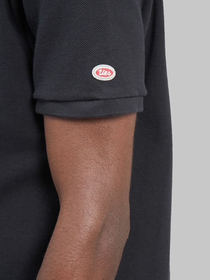 ues polo shirt black logo sleeve